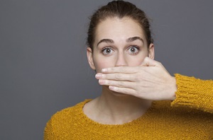 Young woman with bad breath